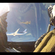 Illustration for article titled Extremely rare photo of two armed F-16s escorting a Boeing Dreamliner